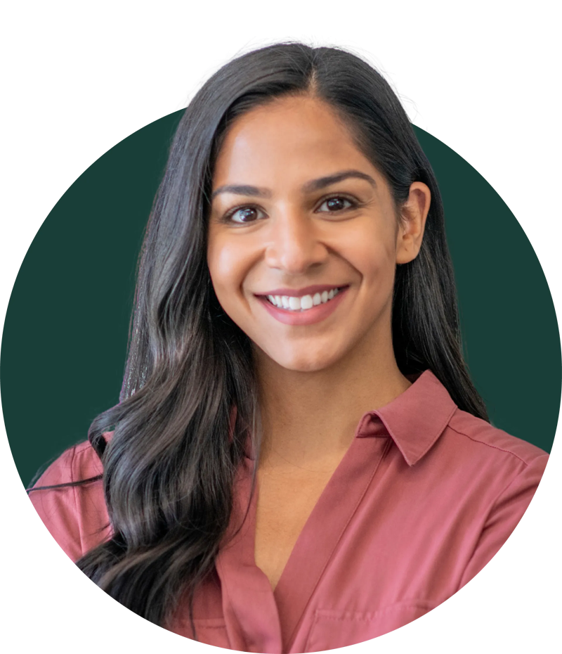 Woman smiling with bright, natural-looking teeth after receiving porcelain veneers at Loudoun Family & Cosmetic Dentistry in Leesburg, VA