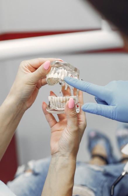 Dentist holding a dental mold of a patient’s teeth at Loudoun Family & Cosmetic Dentistry in Leesburg, VA Dentist holding a dental mold of a patient’s teeth at Loudoun Family & Cosmetic Dentistry in Leesburg, VA