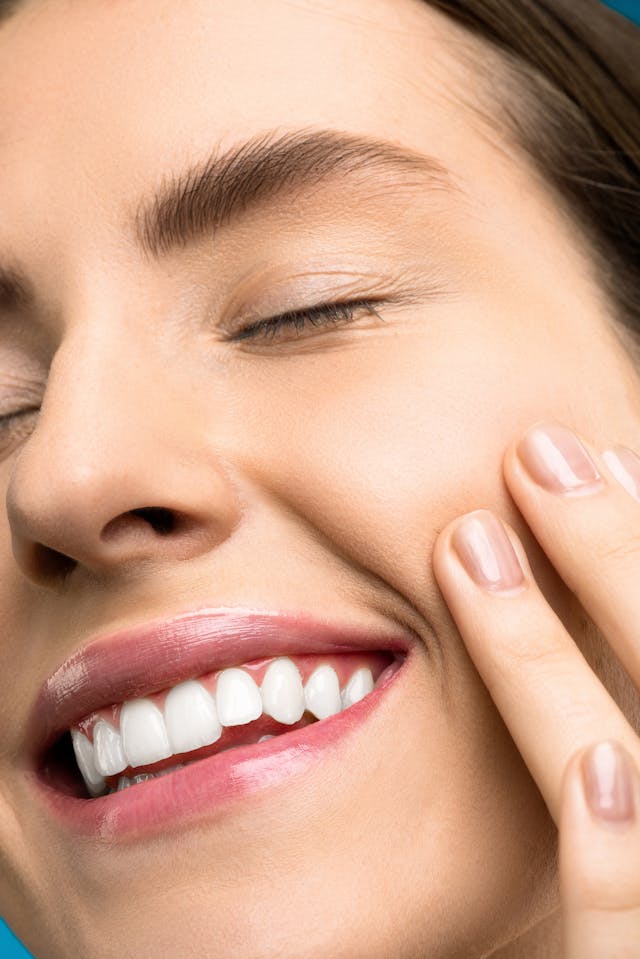 Close-up of a woman smiling, showing healthy teeth and a bright smile after dental treatment at Loudoun Family & Cosmetic Dentistry in Leesburg, VA Close-up of a woman smiling, showing healthy teeth and a bright smile after dental treatment at Loudoun Family & Cosmetic Dentistry in Leesburg, VA